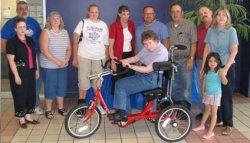 Julie Lewis with her AmTryke Therapeutic Tricycle