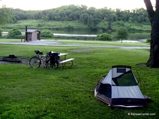 Atchison State Fishing Lake - Campsite - This is a typical campsite at Atchison State Fishing Lake, with a picnic table, fire ring, grass for tents, and plenty of shade, with nearby access to restrooms and the lake.