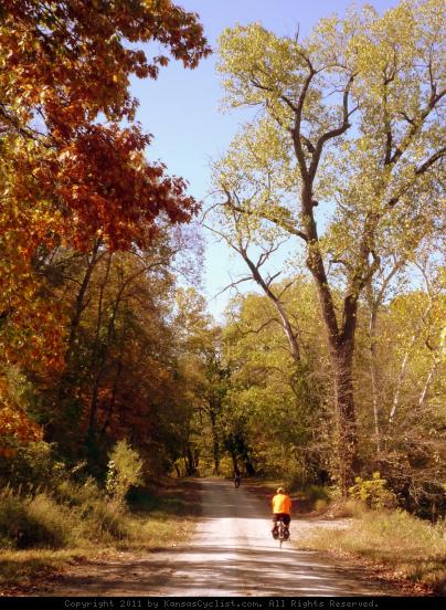 Linn County, Kansas Cyclists - Cyclists enjoying the fall colors on Queens Road, near the Marais des Cygnes National Wildlife Refuge, in Linn County, Kansas.