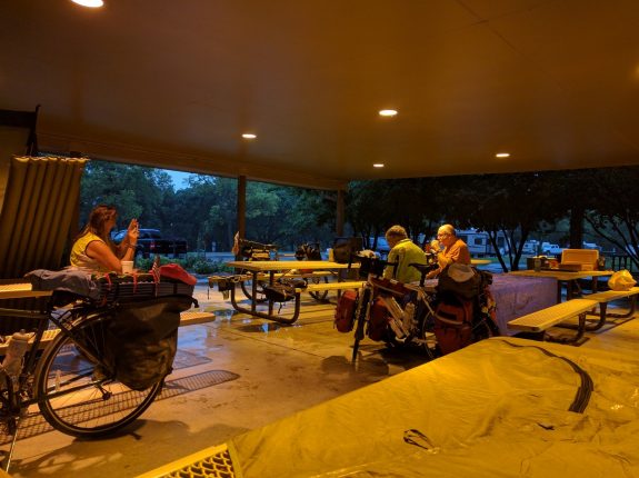 Taking shelter and waiting out an early-morning storm in Topeka. Weather is just part of the deal when travelling by bike. You make the best of it.