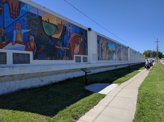 Appreciating the Art Mural Wall in downtown Topeka.