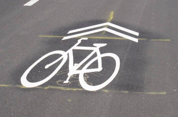 We will need to educate motorists what this sign means: bicyclists may use any portion of the full width of the lane.