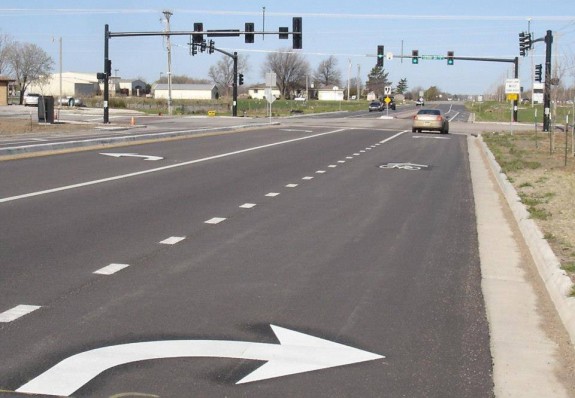 Motor vehicles can turn right in this lane, they just need to share the road with cyclists. Should be easy, but this will take public education efforts.